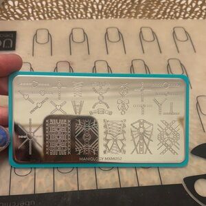 Maniology MXM052 Nail Stamping Plate - Silver Designs with Teal Border